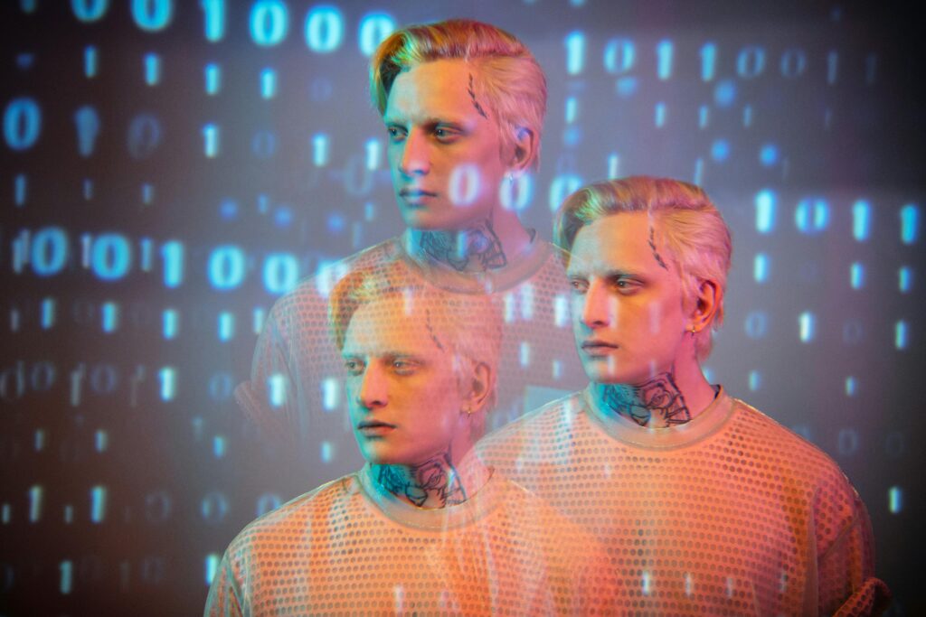 Creative portrait of a man with binary code overlay, blending fashion and digital art.